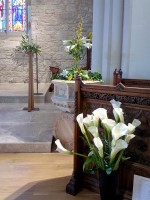 Memorial lilies and Paschal Candle