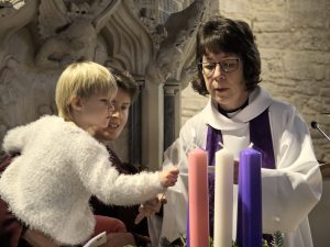 Zoe lit the first candle in our Advent wreath, the candle of hope.